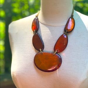 Lucite Oversized statement  brownish orange-coloured  on a leather cord necklace